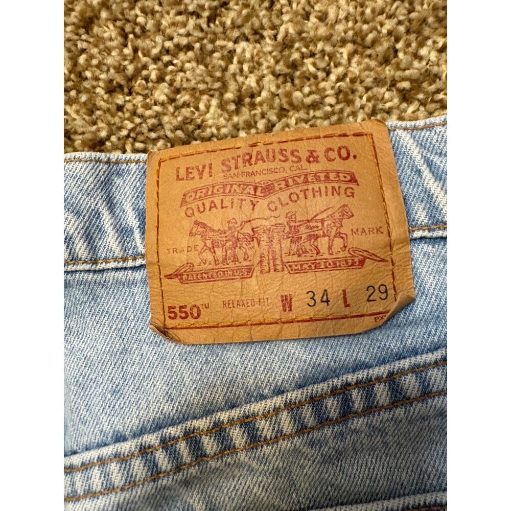 Vintage Levi's 550 Relaxed Fit Made in USA Light Wash Jeans Mens Size 34x29